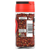 The back of a glass jar of Schwartz Crushed Chillies 29G, showing the barcode, recycling information, and storage instructions.