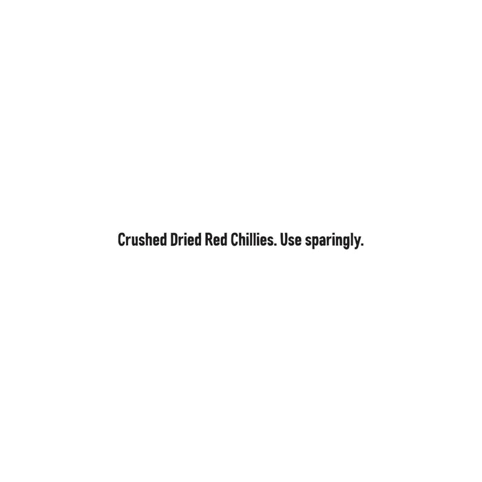 The packaging for Schwartz Crushed Chillies 29G features bold, black text on a white background, reading, Crushed Dried Red Chillies. Use sparingly.