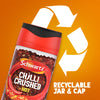 A jar of Schwartz Crushed Chillies 29G is shown against an orange background with a large recycling symbol to emphasize that the jar and cap are recyclable.
