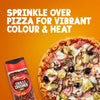 An advertisement shows a jar of Schwartz Crushed Chillies 29G next to a pizza topped with ham, mushrooms, and artichokes, suggesting its use for adding vibrant colour and heat.