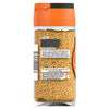 A clear glass Schwartz Mustard Seed 48G Jar filled with yellow mustard seeds features a label with cooking tips and brand contact information.