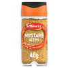 A clear glass Schwartz Mustard Seed 48G Jar with an orange and black lid filled with whole yellow mustard seeds.