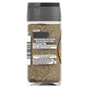 A glass jar of Schwartz Ground Black Pepper showing the back label with usage tips and company details.