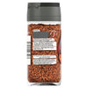A clear glass jar of Schwartz Black And Red Pepper, 45G shows the back label with ingredients including black pepper and cayenne pepper alongside a chili heat level indicator.