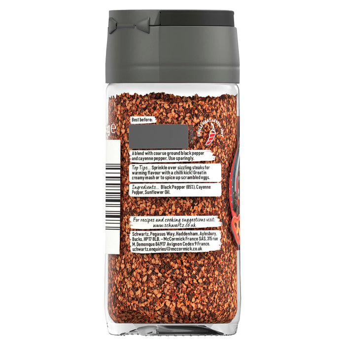 A clear glass jar of Schwartz Black And Red Pepper, 45G shows the back label with ingredients including black pepper and cayenne pepper alongside a chili heat level indicator.