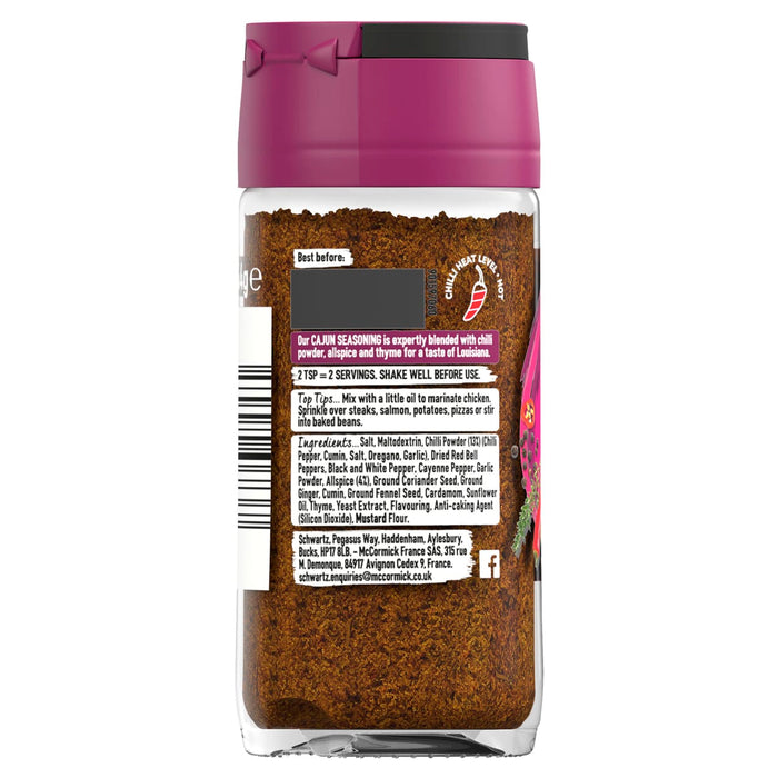 The back of a glass jar of Schwartz Cajun Seasoning 44G is shown, detailing the ingredients, usage tips, and a hot chilli heat level.