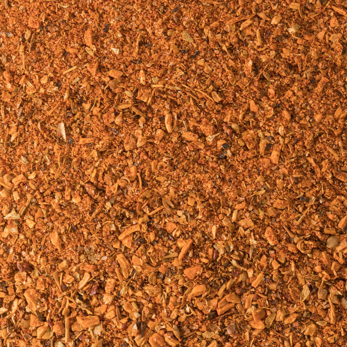 A detailed close up view shows the vibrant and textured blend of herbs and spices that make up Schwartz Cajun Seasoning 44G.