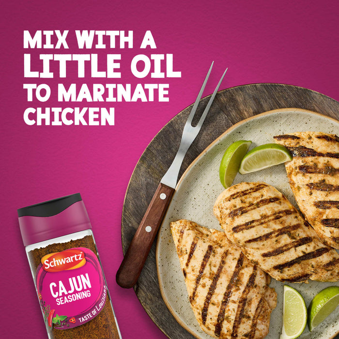 A bottle of Schwartz Cajun Seasoning 44G is shown next to a plate of grilled chicken breasts and lime wedges with text suggesting to mix the spice with oil for a marinade.