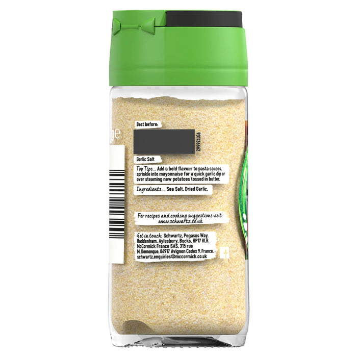 The back label of a glass jar of Schwartz Garlic Salt with a green lid displaying ingredients and cooking suggestions.