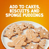 A plate of festive gingerbread cookies decorated with white icing illustrates how to use Schwartz Ground Ginger 26G Jar in your holiday baking.