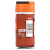 A clear glass jar of Schwartz Paprika Hot, 34G shows the vibrant red spice inside and features a barcode and recycling information on the label.