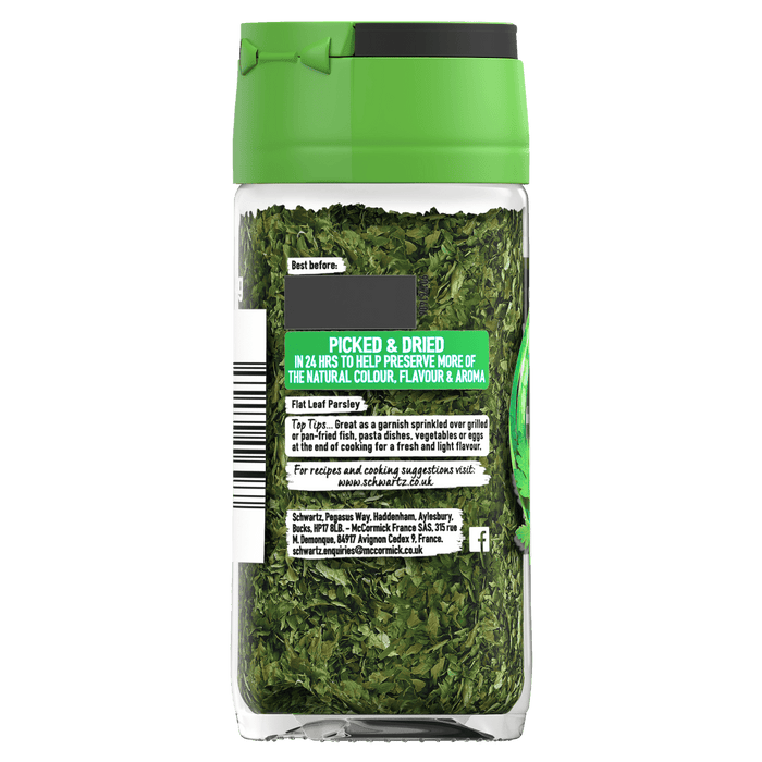 The back of a clear jar of Schwartz Flat Leaf Parsley 3G displays cooking suggestions and company information against a background of the dried green herb.