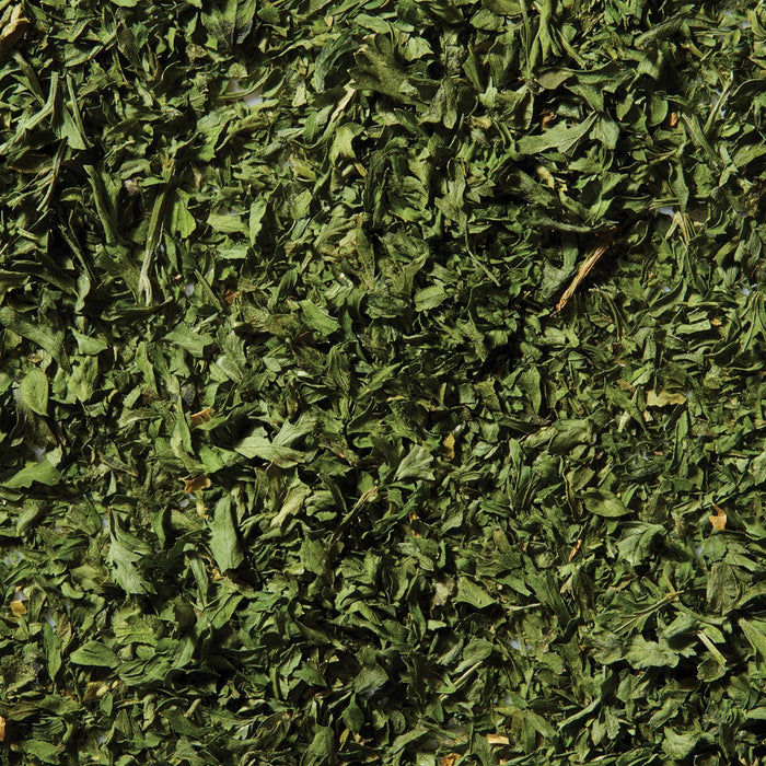 A close-up, top-down view shows the texture of dried Schwartz Parsley, 3G.