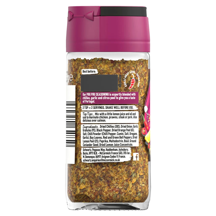 The back of a glass jar of Schwartz Piri Piri Seasoning, 39G, displays the ingredients, usage tips, and company information on its label.