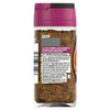 The back of a glass jar of Schwartz Pepper & Garlic Steak Seasoning 46G displays the coarse blend of spices and the product label with ingredients and usage tips.