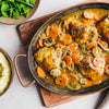 A hearty meal featuring golden chicken thighs and sliced vegetables prepared with Schwartz Chicken Casserole Recipe Mix 36G served alongside mashed potatoes and green beans.