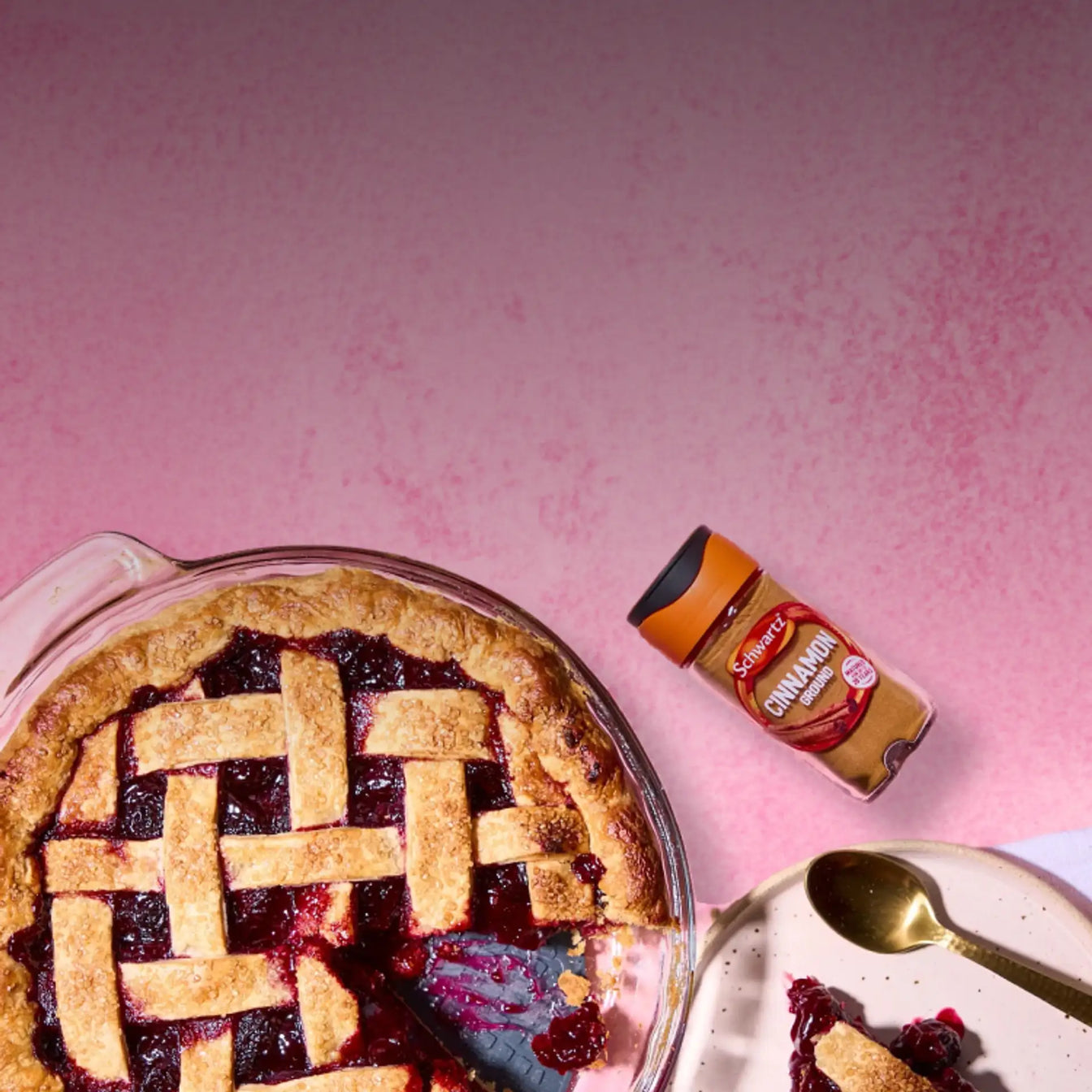 Blueberry pie with lattice crust on a pink background
