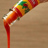Cholula Hot Sauce being poured
