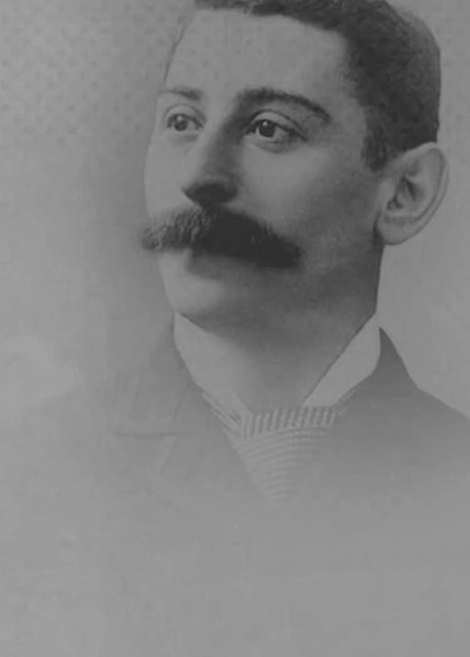 Black and white portrait of a man with a mustache